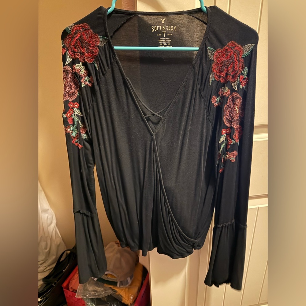 Black long sleeve top with floral sleeves
